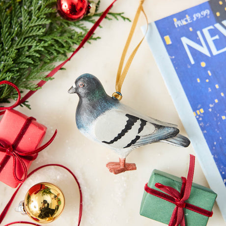 A hand-painted Rock Dove Pigeon Ornament, handmade in the Philippines with softly shaded details and a satin hanging ribbon.


A familiar city friend takes on old-world charm in our Rock Dove Pigeon Ornament. 