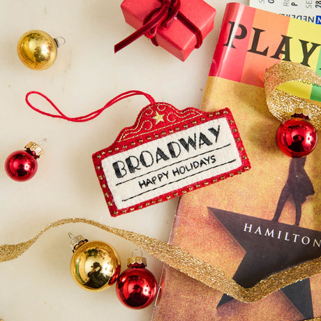 Capture the magic of Broadway with our handmade Broadway Marquee Ornament, a festive felt tribute to New York City's legendary Theater District and the unforgettable joy of live performance.