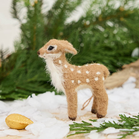 Soft, fuzzy, and impossibly adorable, our Fuzzy Deer Ornament captures the innocence and gentle wonder of a baby deer. With its sweet little face, delicate features, and beautiful white spots sprinkled across its back, this darling little fawn looks as though it has wandered straight out of an enchanted woodland fairy tale.