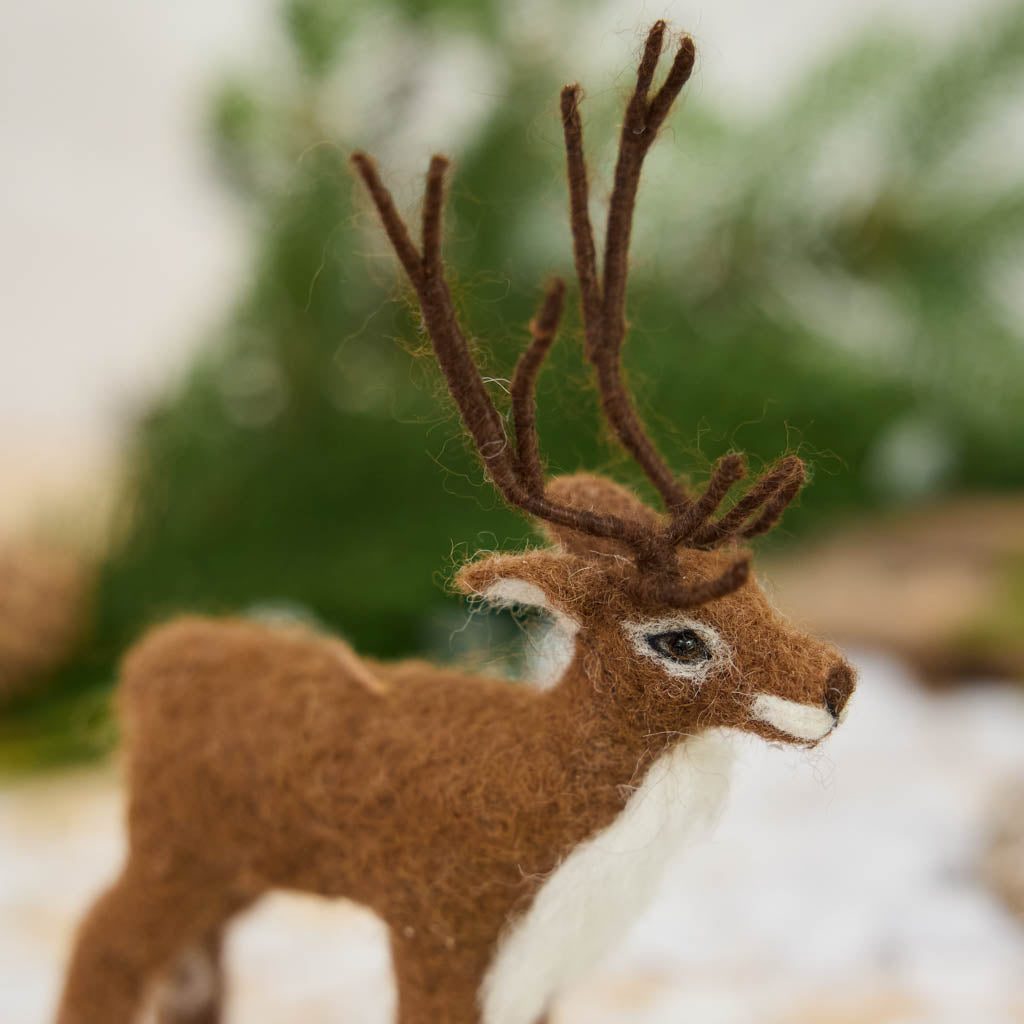 Soft, fuzzy, and full of woodland wonder, our Fuzzy Reindeer Ornament captures the quiet magic of the holiday season. With its beautiful tall antlers, sweet expression, and irresistibly fluffy coat, this darling little reindeer looks as though it has wandered straight out of an enchanted winter forest.