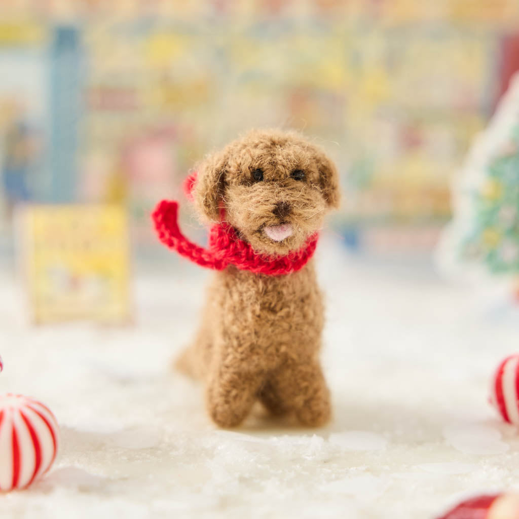 Calling all dog moms, dads, and doodle devotees—your tree just found its new best friend! Our Golden Doodle Ornament is handmade with love in a small workshop in Peru, using the softest, fluffiest felted alpaca wool. One look at those sweet eyes and curly golden fur and you’ll be saying “Good boy!” to your Christmas tree.