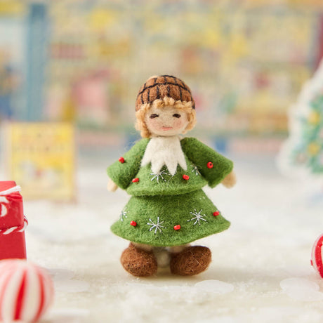  Inspired by the gentle wonder of Waldorf traditions, our Little Acorn Kid Ornament captures the whimsical spirit of a woodland fairy tale. Wearing an adorable felted acorn cap and a charming oak-leaf skirt.