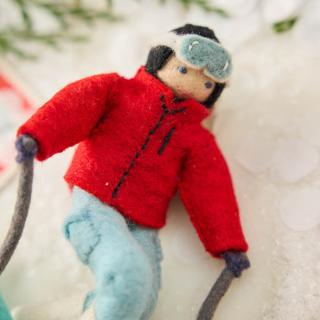 Meet You on the Slopes! Fresh mountain air, snowy slopes, and a little alpine adventure! Our Alpine Skier Ornament is ready to carve through the holiday season in style. 