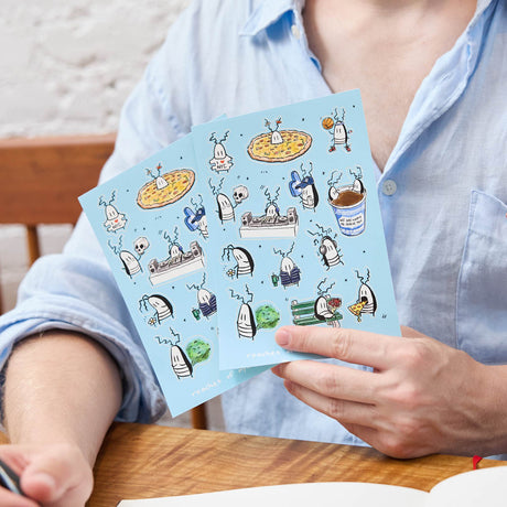 A playful NYC-themed sticker sheet featuring illustrated cockroach characters by artist JG Debray, created in collaboration with Roaches of NYC and Craftspring.
