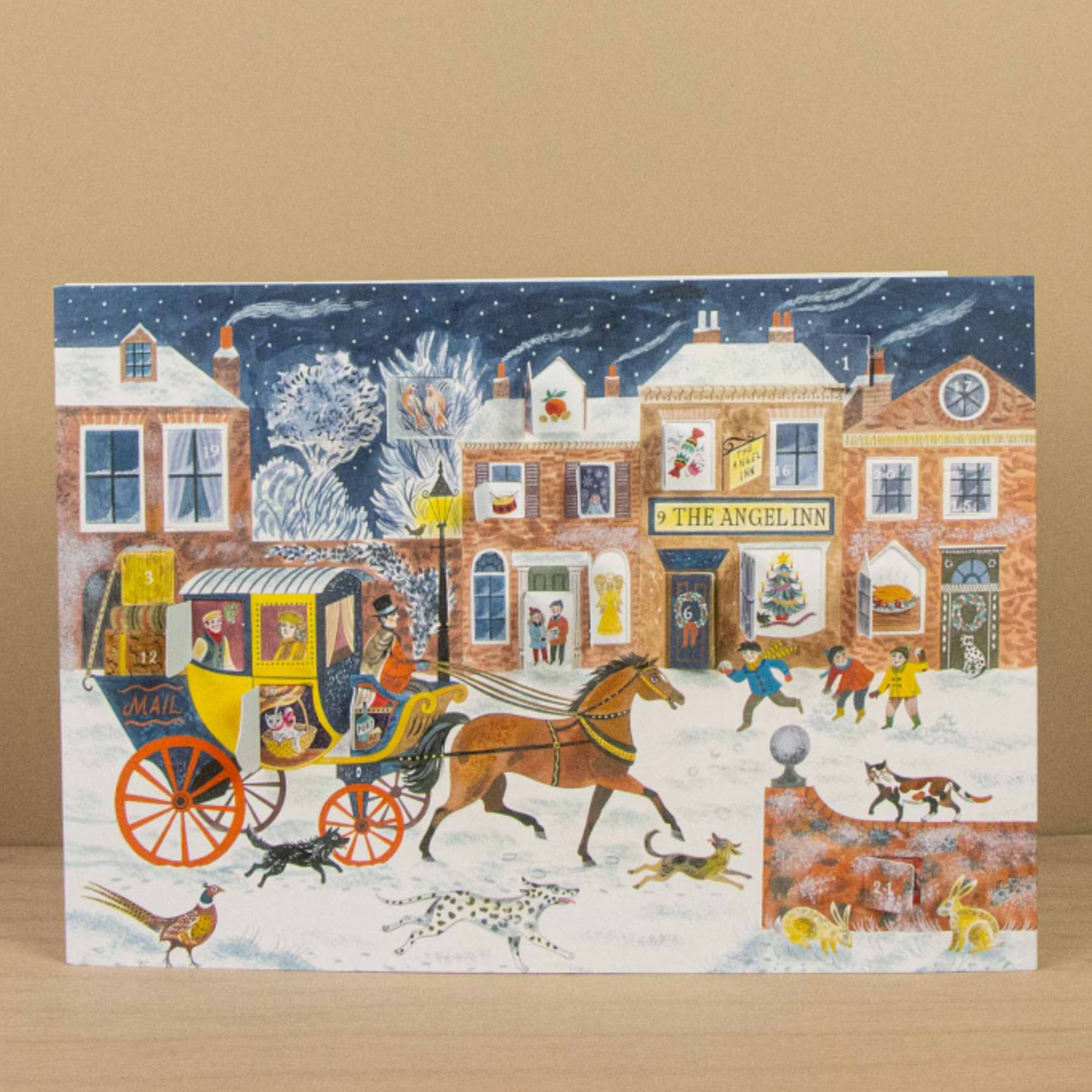 Step into a nostalgic European Christmas with this charming Advent calendar greeting card, illustrated by celebrated British artist Emily Sutton. Inspired by the picturesque Yorkshire countryside and the romance of Victorian England, this enchanting piece captures the magic of a festive high street in miniature.