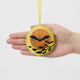 A double-sided handmade beaded Bat &amp; Moon Ornament featuring embroidered bats flying across a glowing full moon, with a playful “Swoop” design on the reverse.