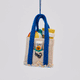 Handmade felt Beach Bag ornament from Craftspring shown from the front, side, and back—filled with playful summer essentials including a beach ball, towel, flip flops, sunscreen, and sunglasses, and finished with beaded sand, ethically crafted by artisans in India using sustainable wool.