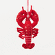 Commemorate the bounty of the northeastern seaboard with our handcrafted Bejeweled Red Lobster Ornament, designed to bring the spirit of coastal Maine to your home. Crafted from vibrant red felt and embellished with sparkling beads and sequins, this festive lobster ornament catches the light beautifully, adding texture, shimmer, and whimsical seaside charm to your holiday décor.