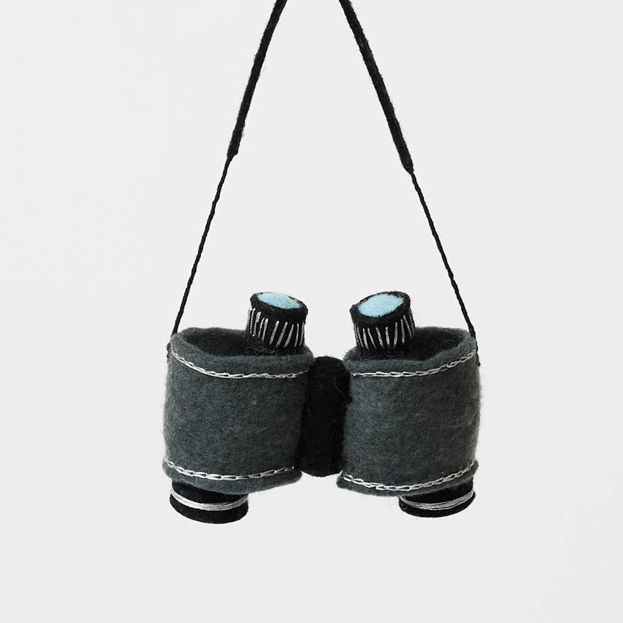 See the world through curious eyes with this hand-felted binoculars ornament, inspired by wildlife watching, outdoor exploration, and the thrill of discovering nature's hidden wonders.