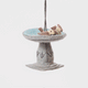 Celebrate the gentle rhythms of the garden with our Bird Bath Ornament. This charming felt scene features two tiny birds enjoying a quiet splash, capturing the simple joy of watching backyard birds gather for a drink on a sunny day.