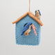 Hand-felted birdhouse ornament with stitched details and soft merino-blend wool