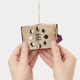 A handmade felt Book of Spells Ornament designed like a miniature mystical grimoire, complete with embroidered details, moon phases, herbal remedies, and a magical all-seeing eye.