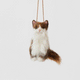 Celebrate the unique beauty of feline companions with our felt Calico Cat Ornament. Carefully handcrafted by skilled artisans, this elegant ornament features the signature patchwork of warm browns, soft whites, and golden tones that make calico cats so beloved.
