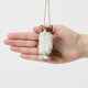 Celebrate the unique beauty of feline companions with our felt Calico Cat Ornament. Carefully handcrafted by skilled artisans, this elegant ornament features the signature patchwork of warm browns, soft whites, and golden tones that make calico cats so beloved.