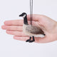 Craftspring’s Canada Goose Ornament displayed in front of a hand to show its size — needle felted with soft wings and beaded eyes, a sweet heirloom-quality piece to celebrate the joy of Christmas gifting — ethically crafted by artisans using sustainable wool.