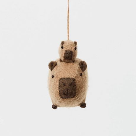 A handmade felt capybara and baby ornament from Kyrgyzstan. Cute as can be —perfect for meaningful gifting and cozy decor.