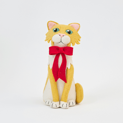 Handmade felt Orange Cat Tree Topper from Craftspring rotating to show front, side, and back views—featuring a festive red bow and playful details, bringing holiday cheer and purr-fect gifting, ethically crafted by artisans using sustainable wool.