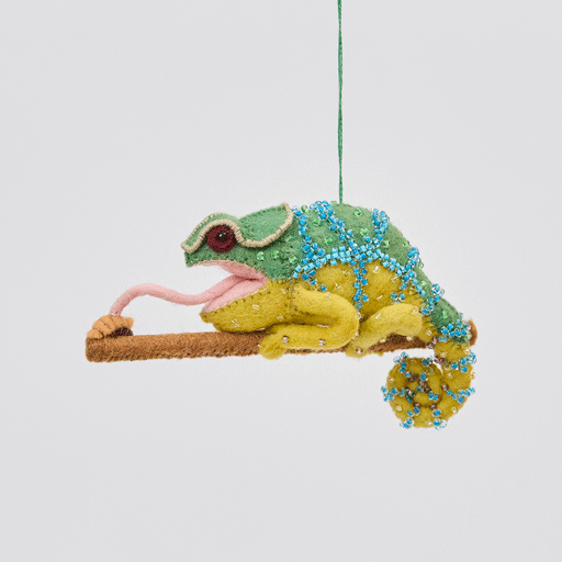 Handmade felt Chameleon ornament from Craftspring rotating to show front, side, and back views—featuring beaded details, a curled tail, and a long tongue catching a bug, ethically crafted by artisans using sustainable wool.