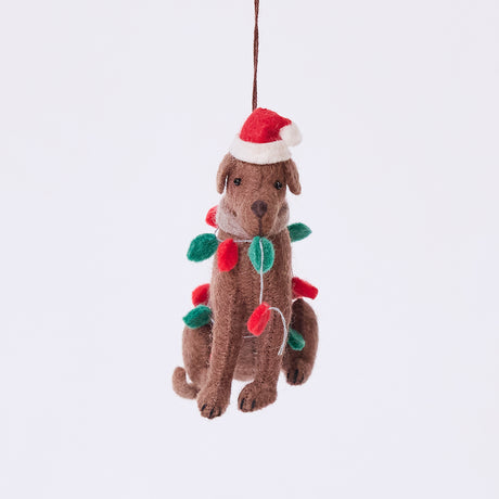 Craftspring’s Chocolate Lab in Christmas Lights Ornament — felt dog wrapped in Christmas lights and wearing a Santa hat, cute and festive — heirloom-quality Christmas ornament, perfect for holiday gifting, ethically crafted by artisans using sustainable wool.