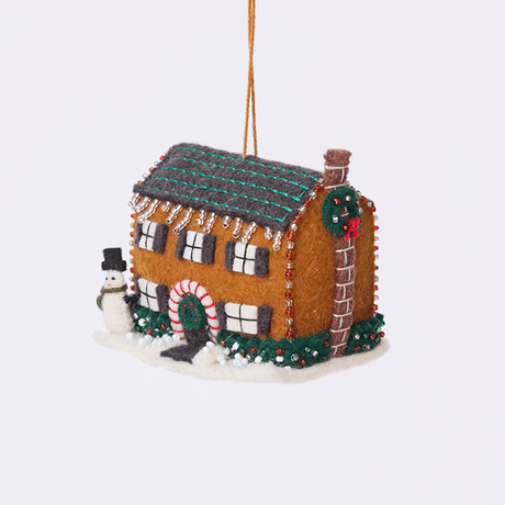 Craftspring’s Christmas House Ornament rotating to show front, side, and back views — felt house with intricate beading, embroidery, and applique, including a snowman in the yard, beaded icicles, and holly bushes, a playful ornament perfect for holiday gifting — heirloom-quality Christmas decor, ethically crafted by artisans using sustainable wool.