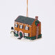Craftspring’s Christmas House Ornament — felt house covered in intricate details with beading, embroidery, and applique, featuring a snowman in the yard, beaded icicles hanging from the roof, and holly bushes around the house — heirloom-quality Christmas ornament, perfect for holiday gifting, ethically crafted by artisans using sustainable wool.