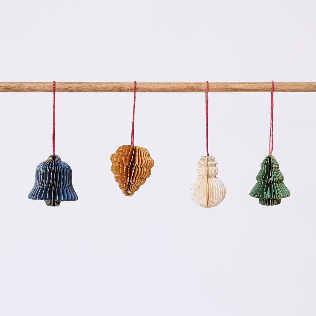Craftspring’s Classic Christmas Honeycomb Paper Mini Ornaments — Set of 4, featuring a snowman, bell, pinecone, and tree, each in a different color with gold sparkly edges — handmade by artisans from recycled cotton waste, perfect for Christmas decorating.