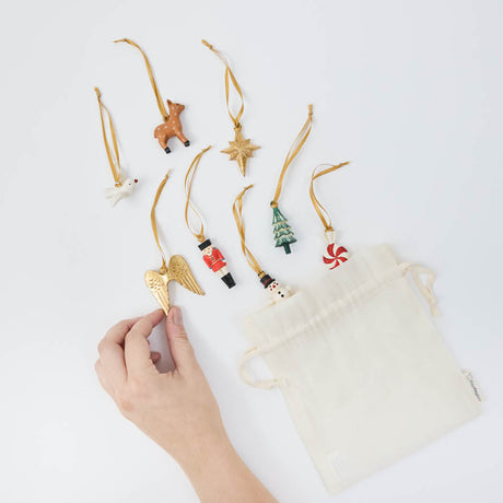 Handmade with love in the Philippines, this sweet set arrives tucked inside a reusable cotton drawstring pouch, ready for gifting, collecting, or bringing a little extra magic to the tree year after year.