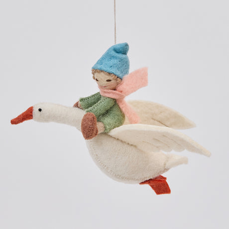 Handmade felt Cloud Dancer Dream Goose Ornament – Light from Craftspring, featuring a detailed baby with light skin and blonde hair riding a flying white goose—showcasing intricate stitching and artisan craftsmanship, ethically crafted using sustainable wool.