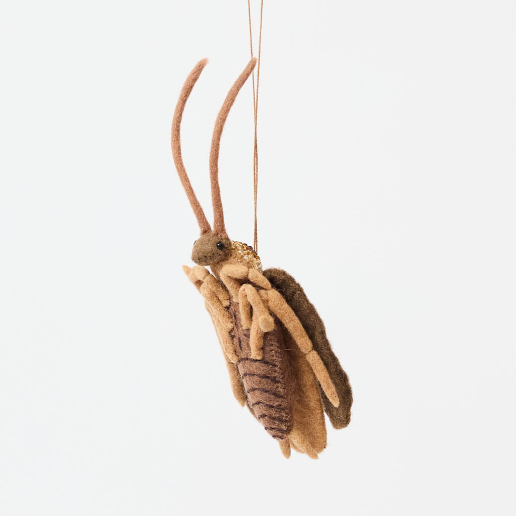 Celebrate one of nature’s most resilient and fascinating creatures with our Cockroach Ornament. 