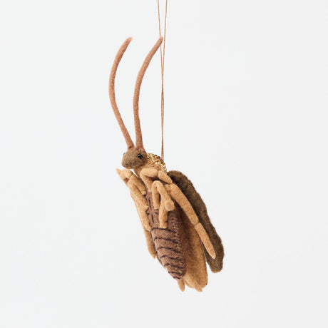 Celebrate one of nature’s most resilient and fascinating creatures with our Cockroach Ornament. 