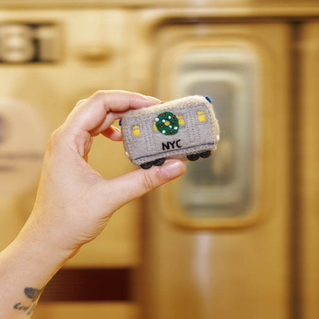 Celebrate the rhythm of New York City with our handmade NYC Subway Train Car Ornament, a charming felt keepsake inspired by the iconic subway cars that keep the city moving.