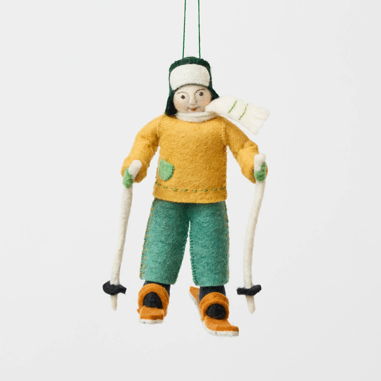  Take the Scenic Route!

There's nothing quite like the peaceful magic of a snow-covered trail! Our Cross-Country Skier Ornament celebrates the simple joys of winter adventures, from gliding through frosty forests to breathing in the crisp mountain air. 