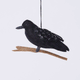 Handmade felt Crow ornament from Craftspring rotating to show front, side, and back views—featuring shimmering wings with intricate beaded details, perched on a branch, perfect for Halloween, harvest decorating, and holiday gifting, ethically crafted by artisans using sustainable wool.