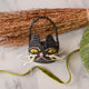 Adorably hand-crocheted, this black cat is ready for autumnal nights! Soft, lightweight, and ethically made, our mini raffia basket is perfectly sized for a little touch of joy. Fill it with treats and treasures for your fall table.&nbsp;