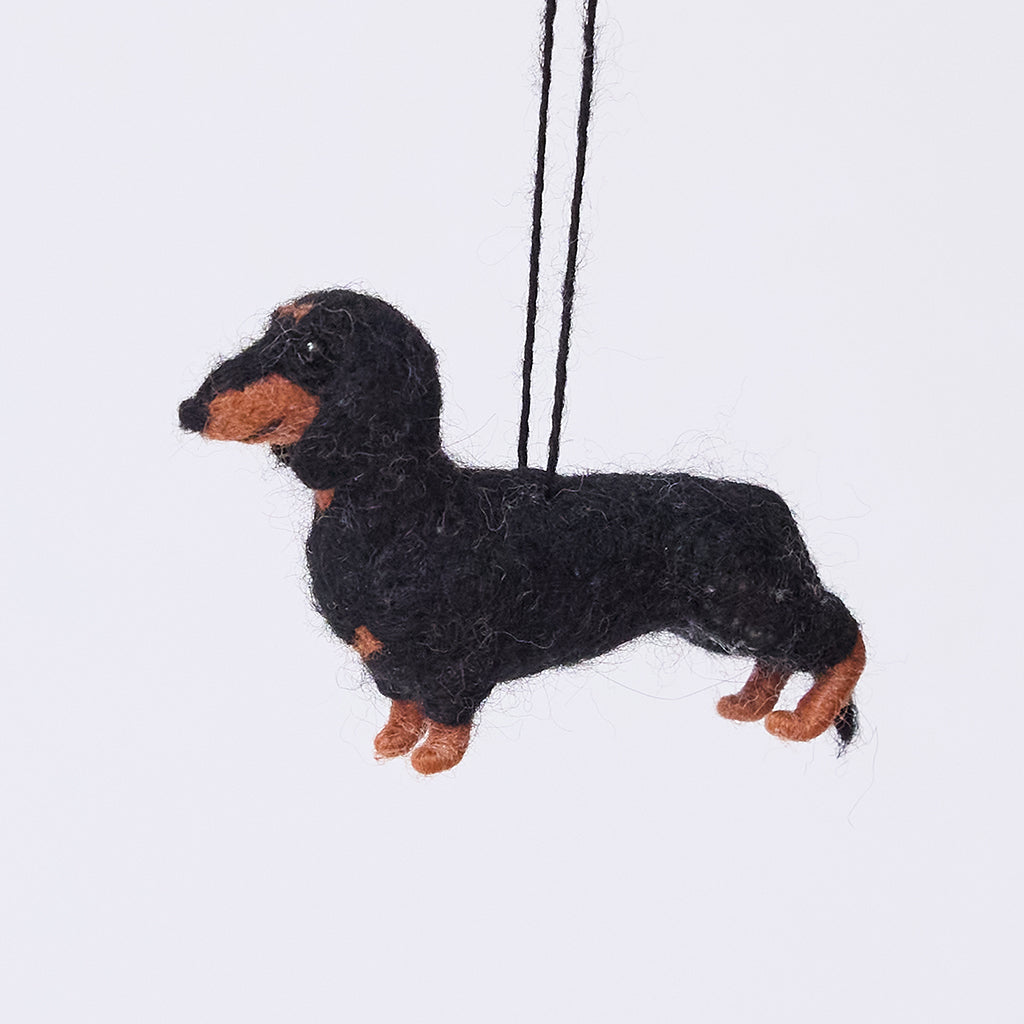 Handmade needle-felted Dachshund Ornament from Craftspring, with short legs and a cute face—adorable Christmas decor, ethically crafted by artisans using sustainable wool.