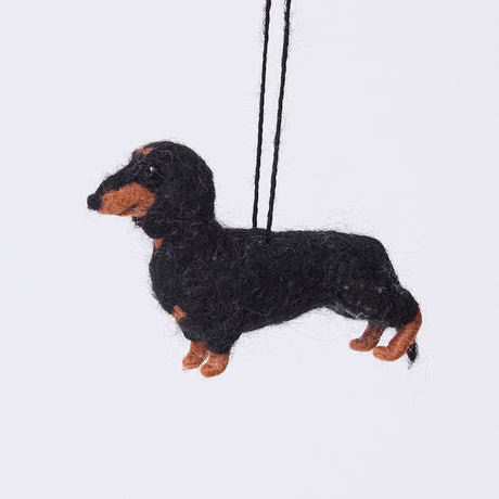 Handmade needle-felted Dachshund Ornament from Craftspring, with short legs and a cute face—adorable Christmas decor, ethically crafted by artisans using sustainable wool.
