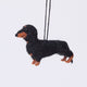 Handmade needle-felted Dachshund Ornament from Craftspring, with short legs and a cute face—adorable Christmas decor, ethically crafted by artisans using sustainable wool.