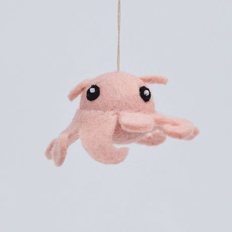 Handmade felt Dumbo Octopus ornament from Craftspring rotating to show front, side, and back views—highlighting curly tentacles and embroidered details, ethically crafted by artisans using sustainable wool.