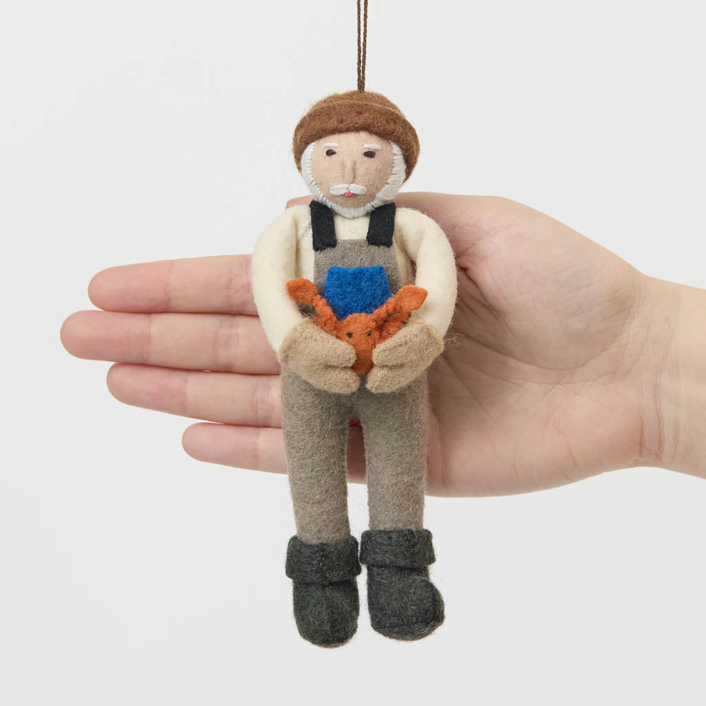 Celebrate the hardworking spirit of America’s coastal fishing communities with this handcrafted Dungeness Crab King Ornament, ethically made from sustainable wool and inspired by generations of fishermen who make their living from the sea.