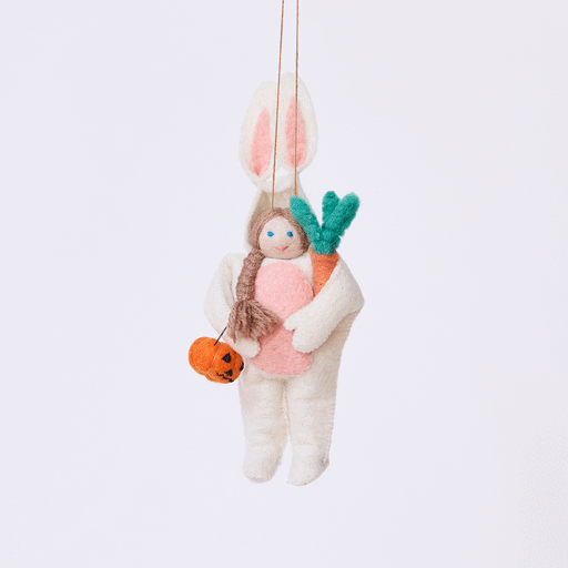 Handmade felt Easter Bunny Trick-Or-Treater ornament from Craftspring rotating to show front, side, and back views—featuring a girl in an Easter Bunny costume holding a pumpkin basket, ethically crafted by artisans using sustainable wool.
