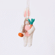 Handmade felt Easter Bunny Trick-Or-Treater ornament from Craftspring rotating to show front, side, and back views—featuring a girl in an Easter Bunny costume holding a pumpkin basket, ethically crafted by artisans using sustainable wool.