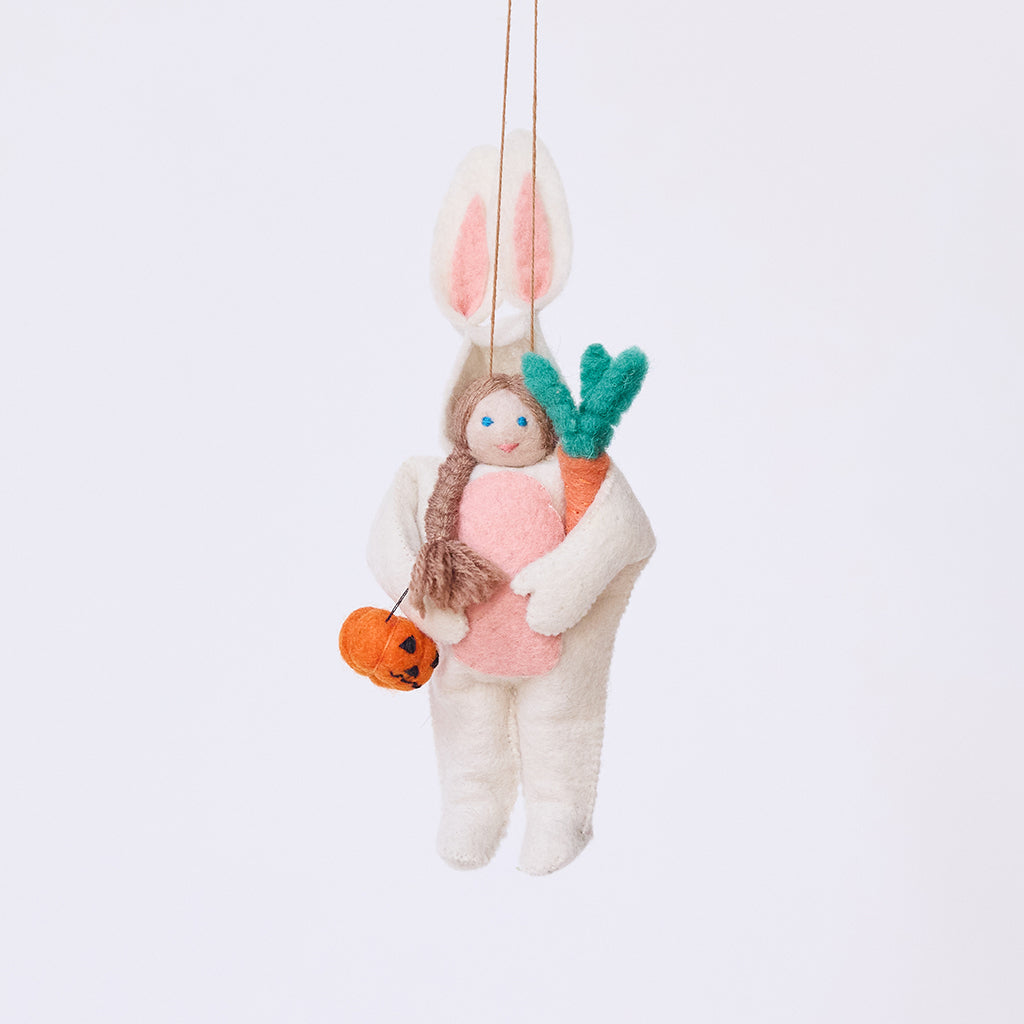 Handmade felt Easter Bunny Trick-Or-Treater ornament from Craftspring, featuring a girl in an Easter Bunny costume holding a pumpkin basket—heirloom-quality Halloween decor, ethically crafted by artisans using sustainable wool.