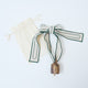 Embossed Bell with Green Ribbon