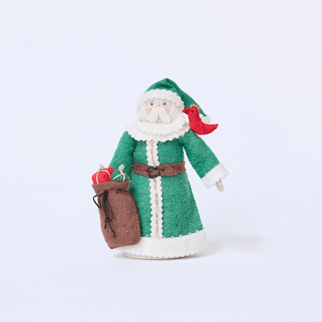 Craftspring’s Emerald Santa Mini Tree Topper rotating to show front, side, and back views — felt Santa in a green cloak with beaded details, holding a sack of presents with a bird on his shoulder, a playful and sweet vintage-style piece for holiday gifting — heirloom-quality Christmas decor, ethically crafted by artisans using sustainable wool.