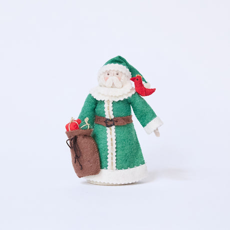 Craftspring’s Emerald Santa Mini Tree Topper — felt Santa in a green cloak with beaded details, holding a sack of presents with a bird resting on his shoulder, in a sweet, vintage-style design — heirloom-quality Christmas tree topper, perfect for holiday gifting, ethically crafted by artisans using sustainable wool.