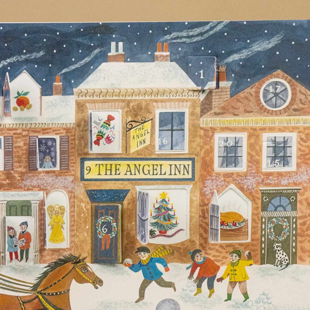 Step into a nostalgic European Christmas with this charming Advent calendar greeting card, illustrated by celebrated British artist Emily Sutton. Inspired by the picturesque Yorkshire countryside and the romance of Victorian England, this enchanting piece captures the magic of a festive high street in miniature.