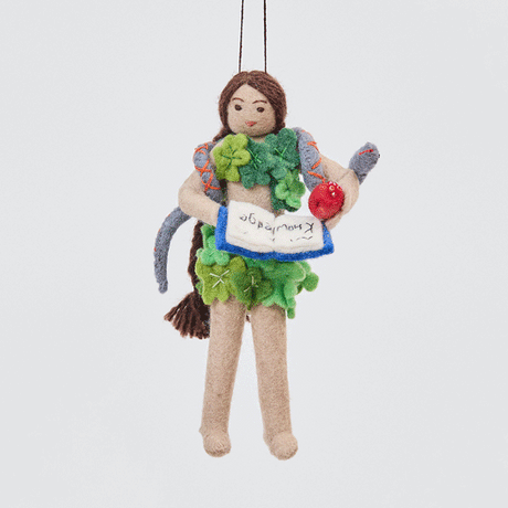 Handmade felt Eve ornament from Craftspring rotating to show front, side, and back views—featuring Eve holding a book of knowledge and an apple, wrapped in leaves with a serpent around her shoulders, ethically crafted by artisans using sustainable wool.