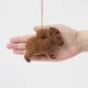 A needle-felted alpaca wool capybara and baby ornament from Peru, symbolizing calm, nurturing love, and gentle family bonds—perfect for meaningful gifting and cozy decor.
