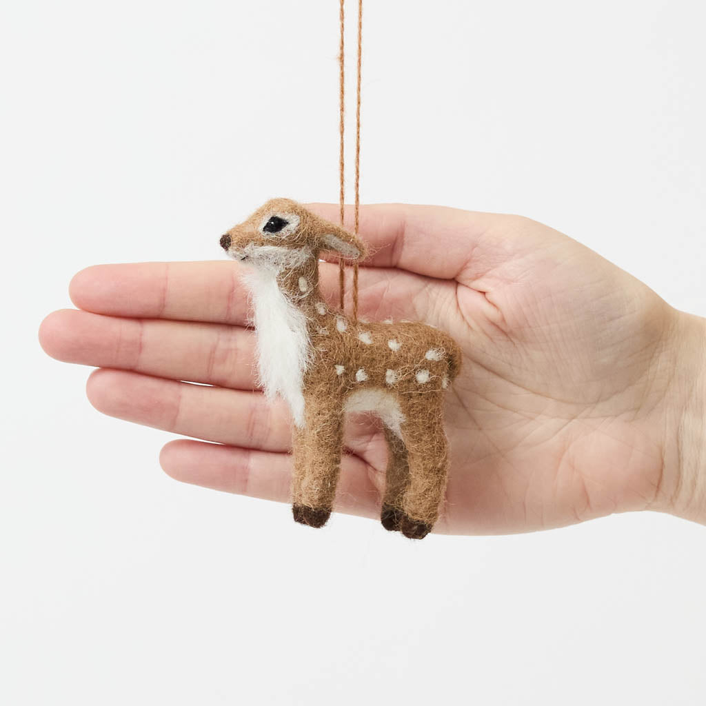 An irresistibly sweet, needle-felted alpaca wool fawn ornament from Peru, featuring delicate white spots, soft fuzzy textures, and lifelike details—bringing the gentle magic of woodland creatures to your Christmas tree.