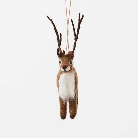 Soft, fuzzy, and full of woodland wonder, our Fuzzy Reindeer Ornament captures the quiet magic of the holiday season. With its beautiful tall antlers, sweet expression, and irresistibly fluffy coat, this darling little reindeer looks as though it has wandered straight out of an enchanted winter forest.